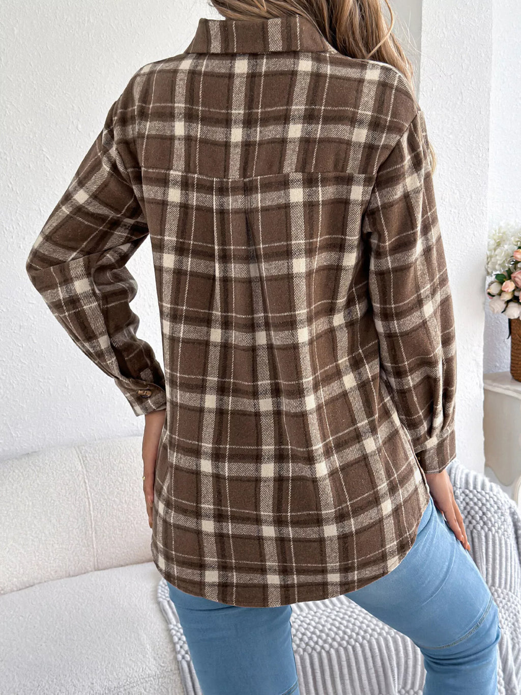 Brown plaid button-down shacket with chest pockets, back view.