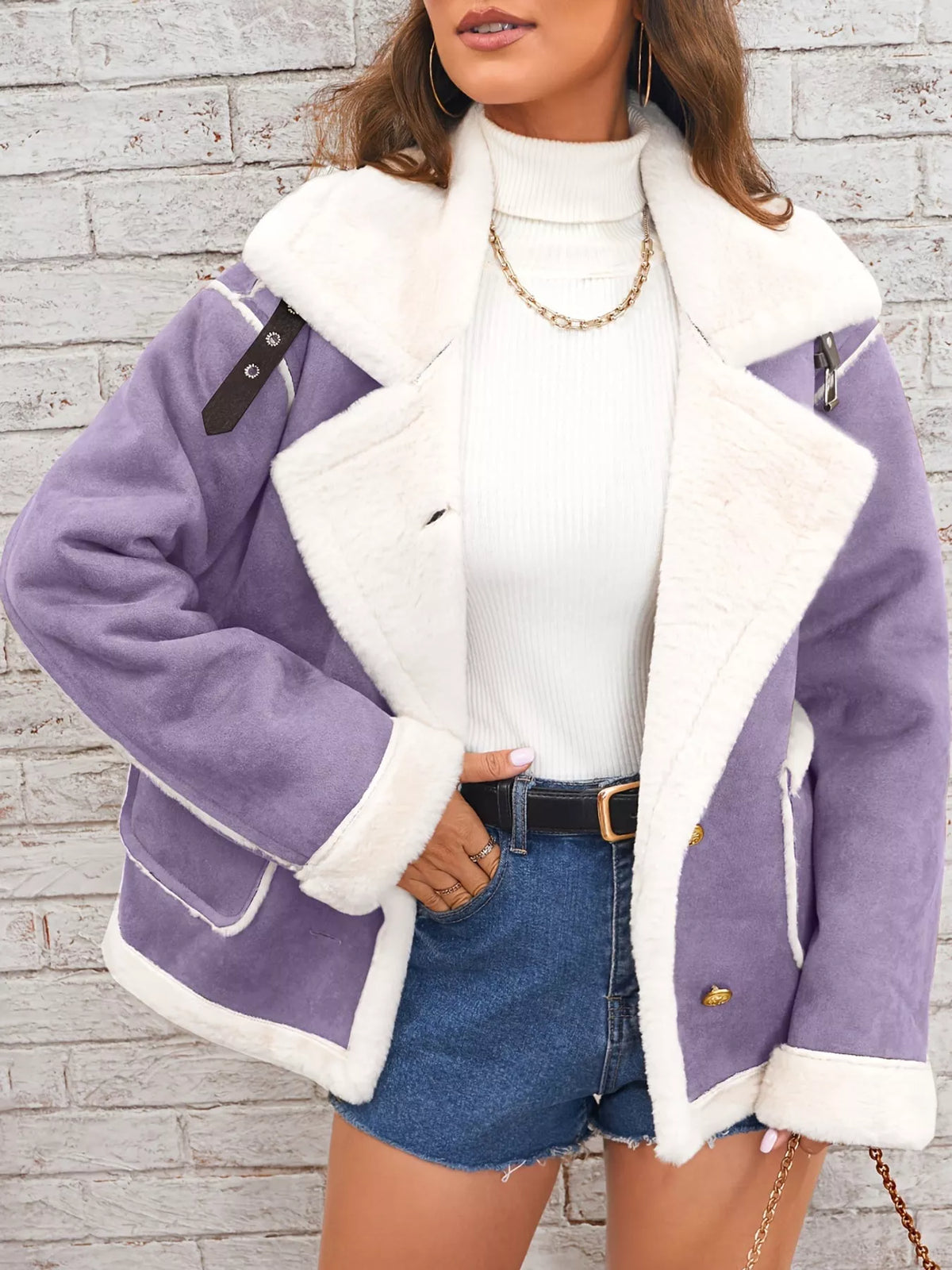 Violet jacket with wide white plush lapels, contrast trim and front pockets, front view modeled with a hand at the hip.