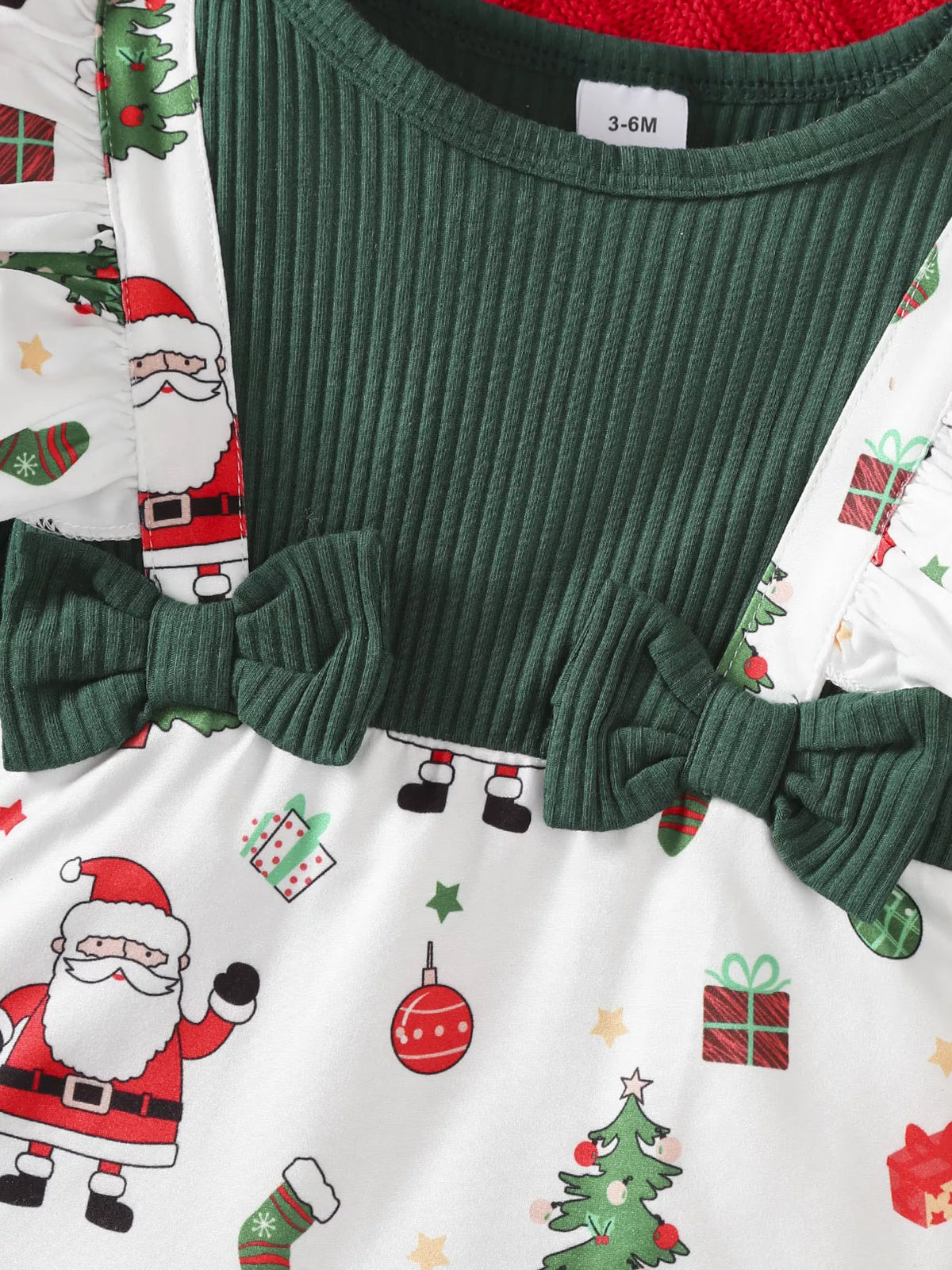 Ribbed green bodice and ruffle straps on the Santa-print jumpsuit