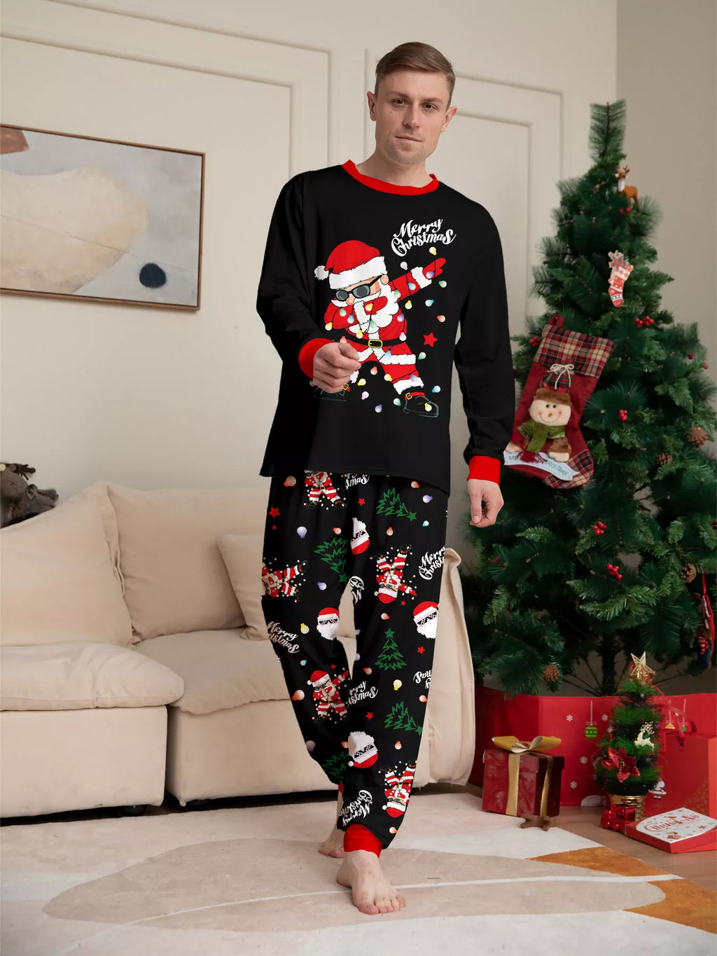 Front view of the men's black Santa graphic Christmas pajamas.