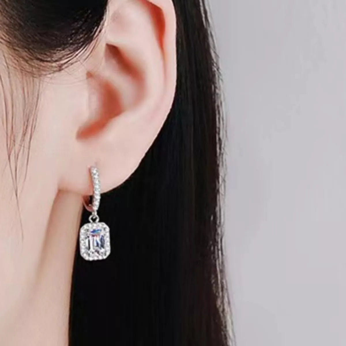 Silver-tone hoop earrings with rectangular halo stone drops — detail view