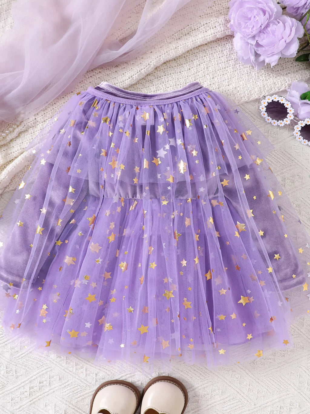 Purple velvet-look dress with star-patterned tulle skirt and mesh cape displayed flat