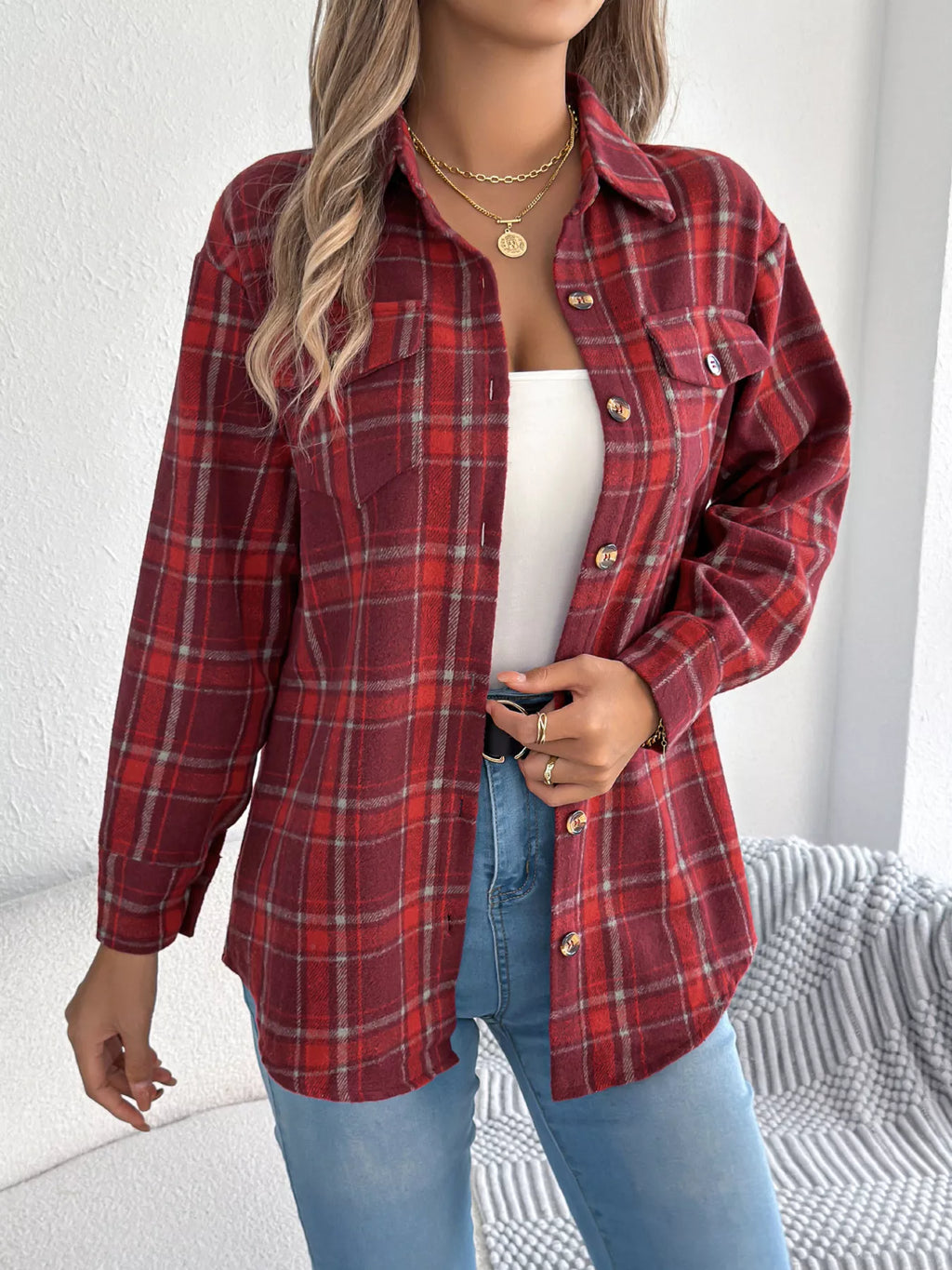 Red plaid button-down shacket with chest pockets, front view.