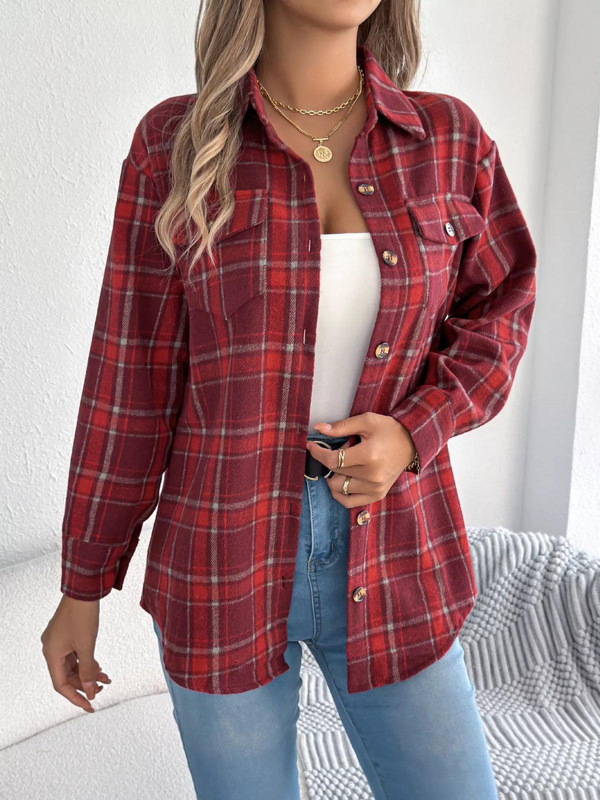 Red plaid button-down shacket with chest pockets, front view.