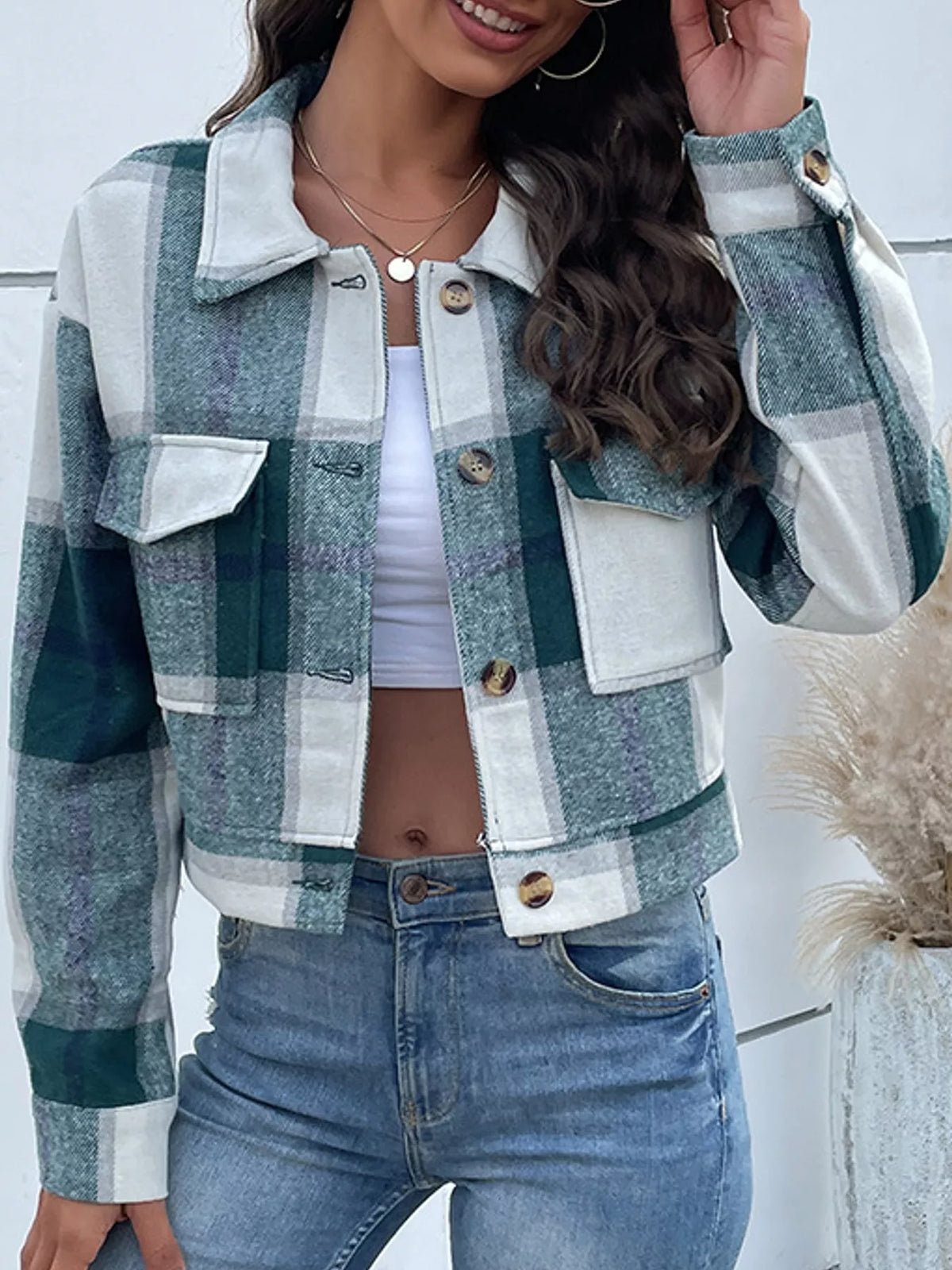 Green color-block plaid cropped jacket with flap chest pockets, front view.