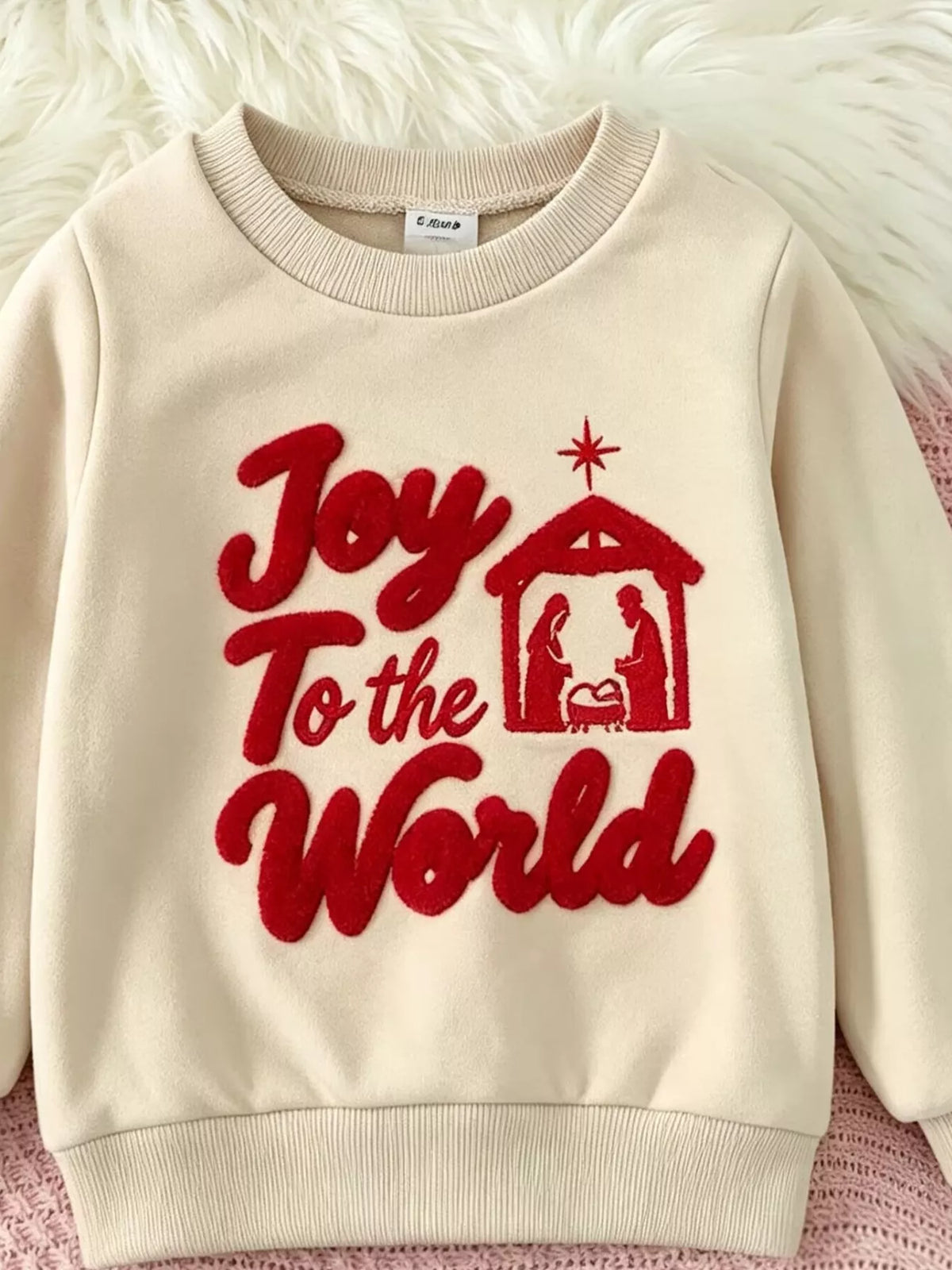 Front view of the cream Joy to the World Christmas graphic sweatshirt.