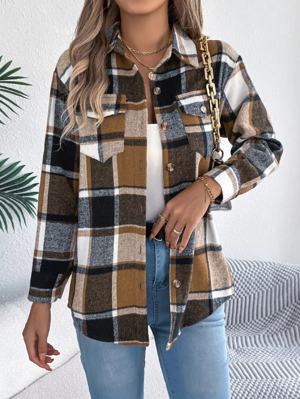 Khaki plaid button-down shacket with chest pockets, front view.