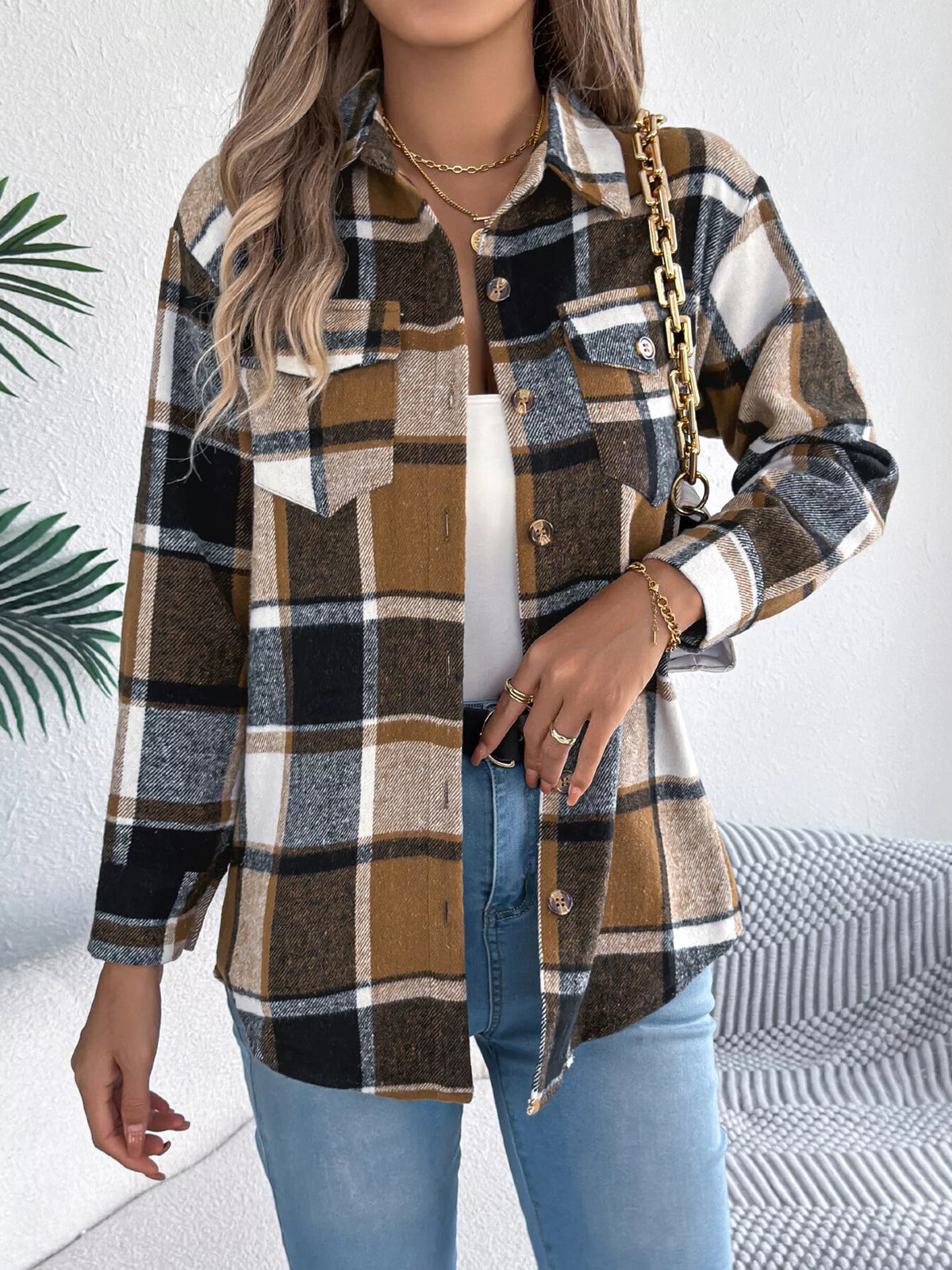 Khaki plaid button-down shacket with chest pockets, front view.