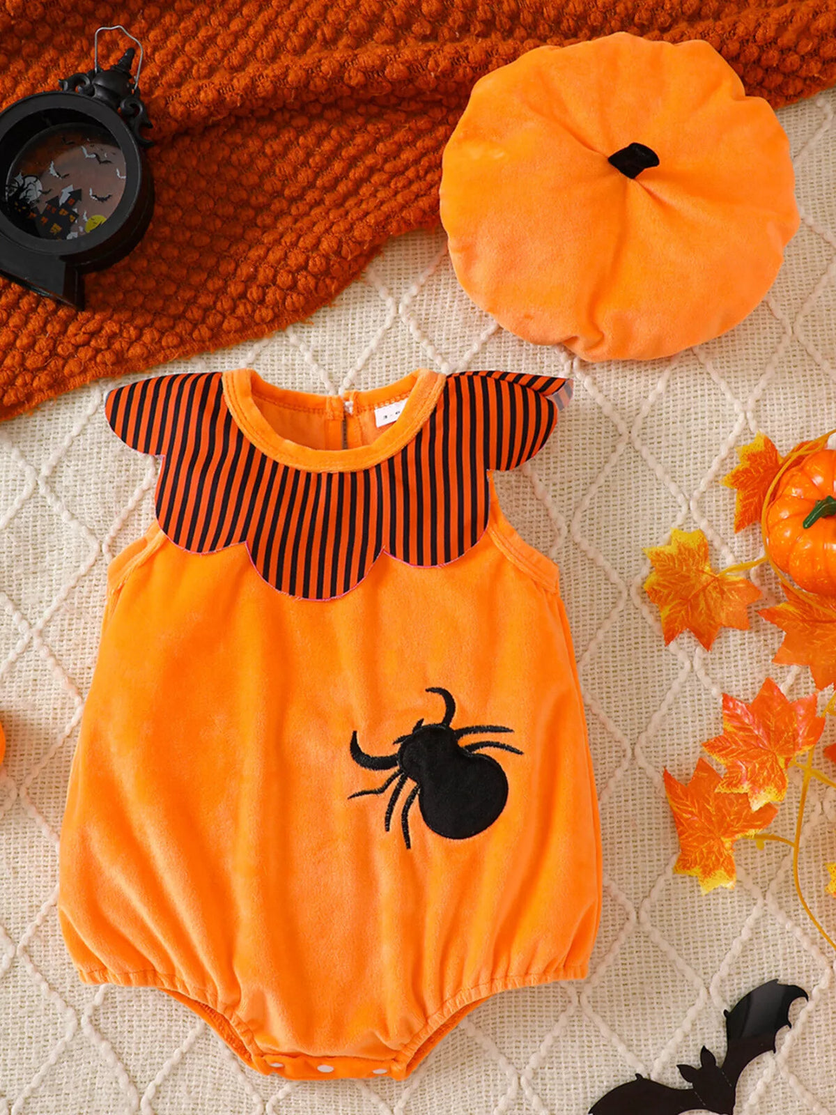 Orange spider-applique baby bodysuit with striped yoke and matching orange hat