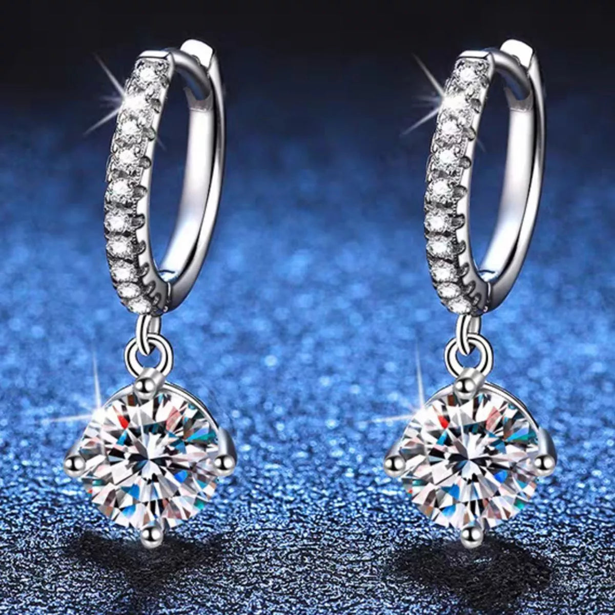 Silver-tone hoop earrings with round halo stone drops — detail view