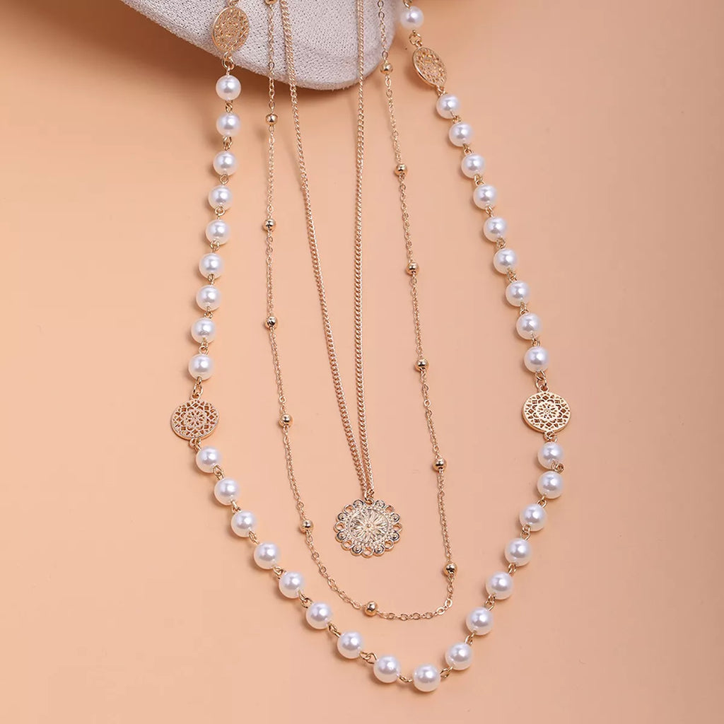 Layered pearl-like bead and coin pendant necklace — detail view