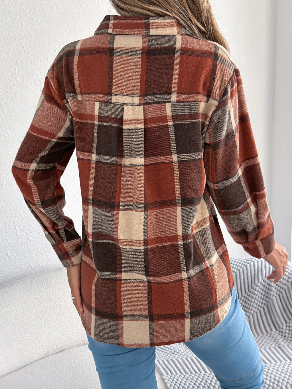 Orange plaid button-down shacket with chest pockets, back view.