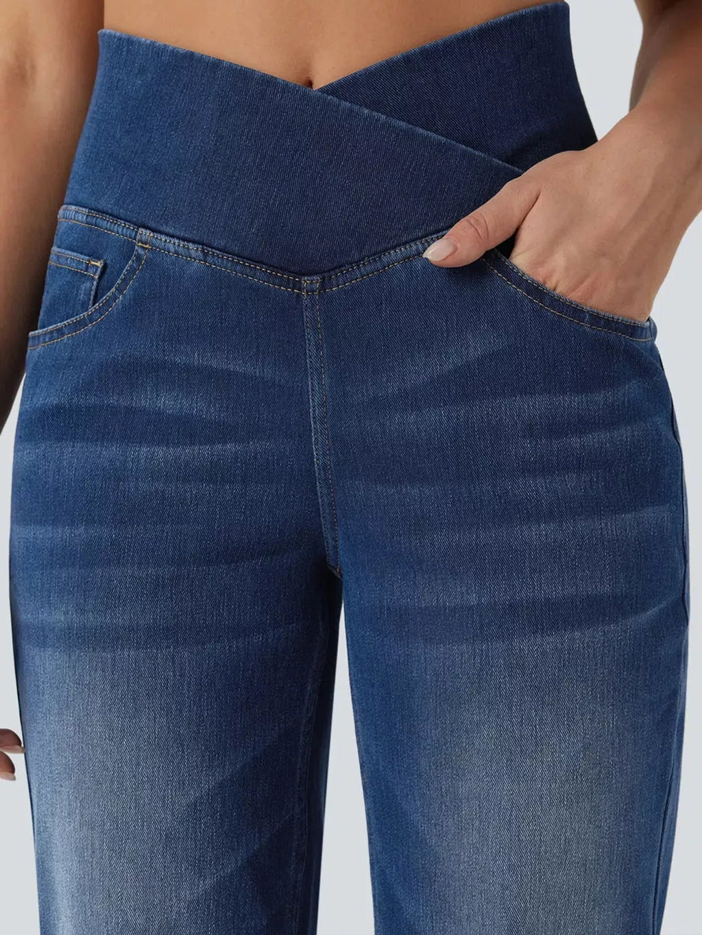 Dark blue high-waisted crossover waistband straight-leg jeans — detail view