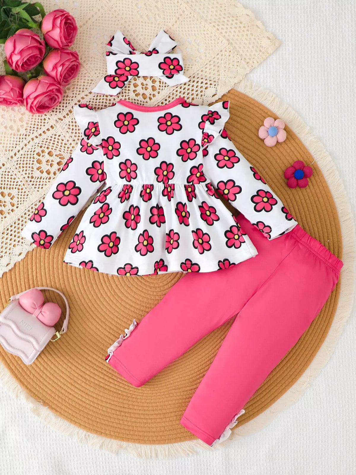 Back flat lay of the white pink-floral top, pink leggings and matching headband.