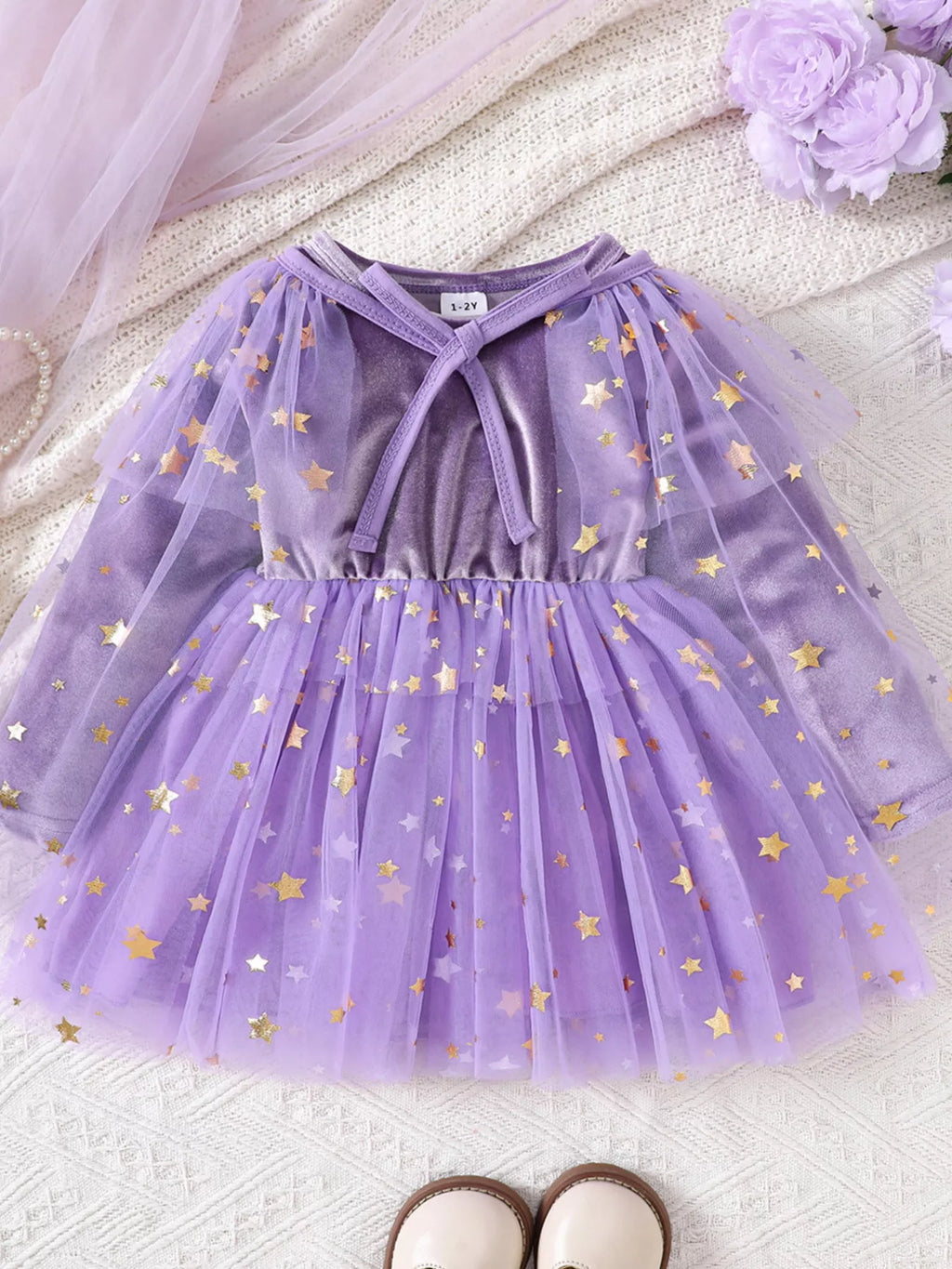 Purple velvet-look dress with star-patterned tulle skirt and mesh cape displayed flat
