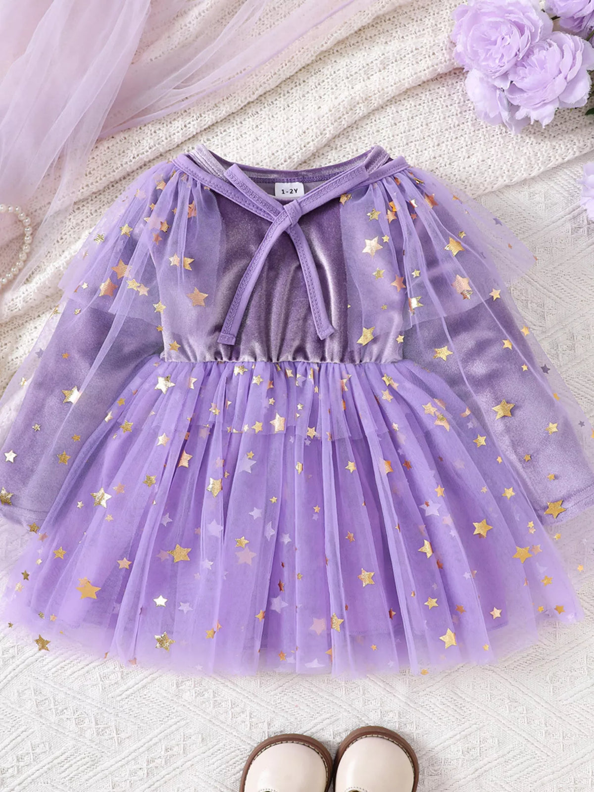 Purple velvet-look dress with star-patterned tulle skirt and mesh cape displayed flat