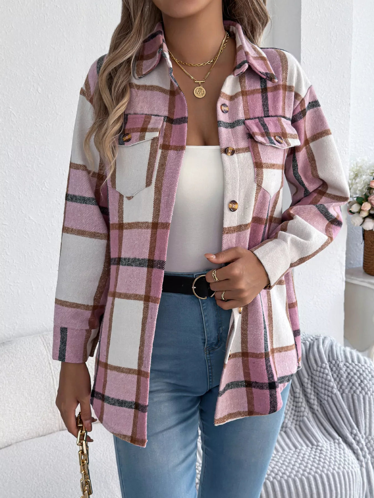 Pink plaid button-down shacket with chest pockets, front view.