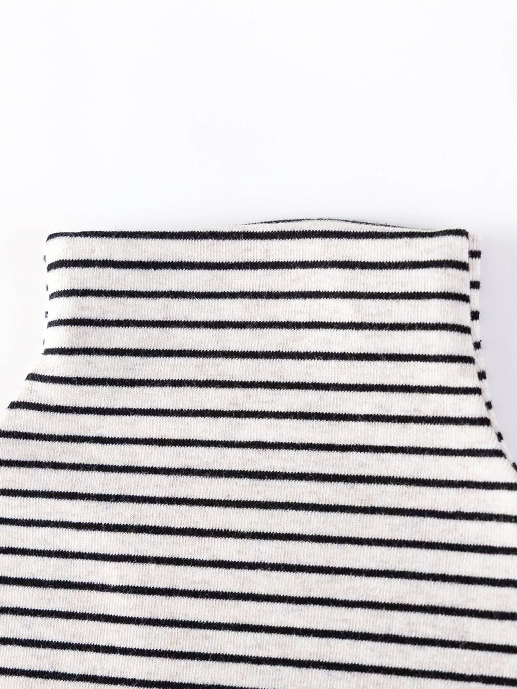 Close-up of the striped top's folded turtleneck collar.