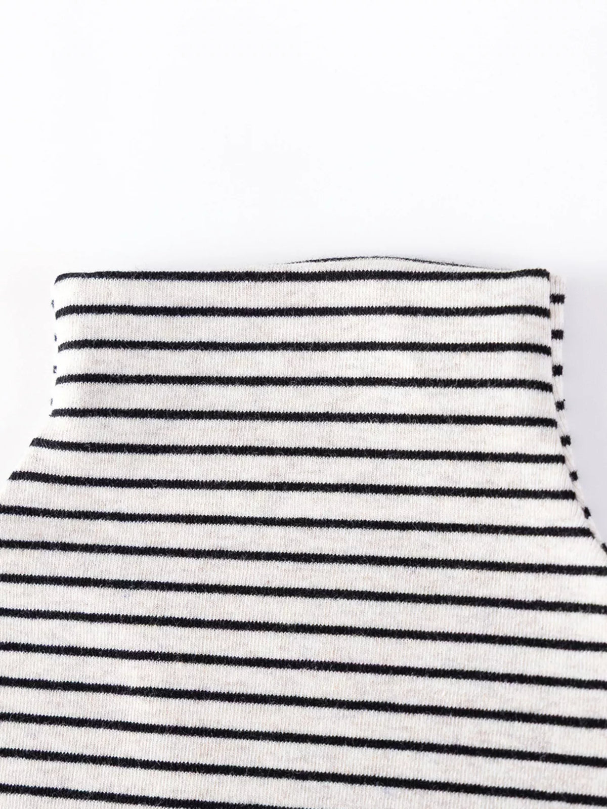 Close-up of the striped top's folded turtleneck collar.