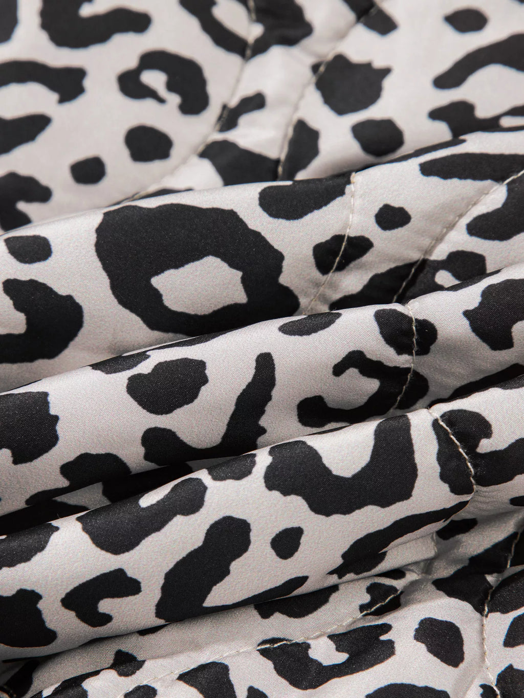 Close-up of the leopard-print fabric and stitching.