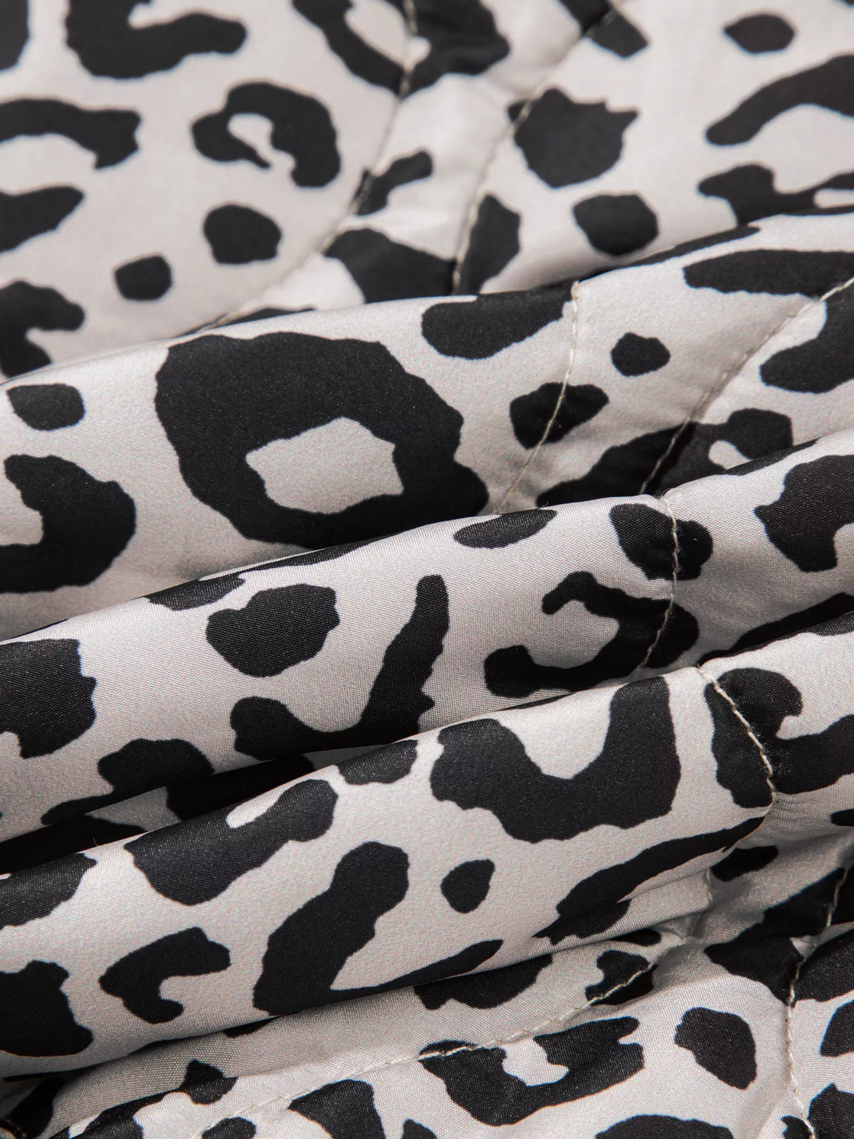 Close-up of the leopard-print fabric and stitching.