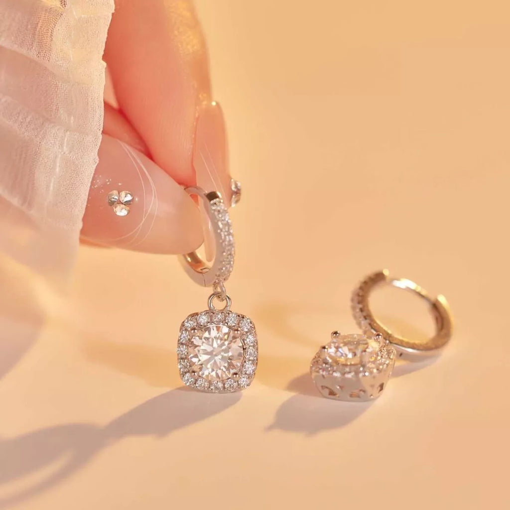 Silver-tone hoop earrings with square halo stone drops — detail view