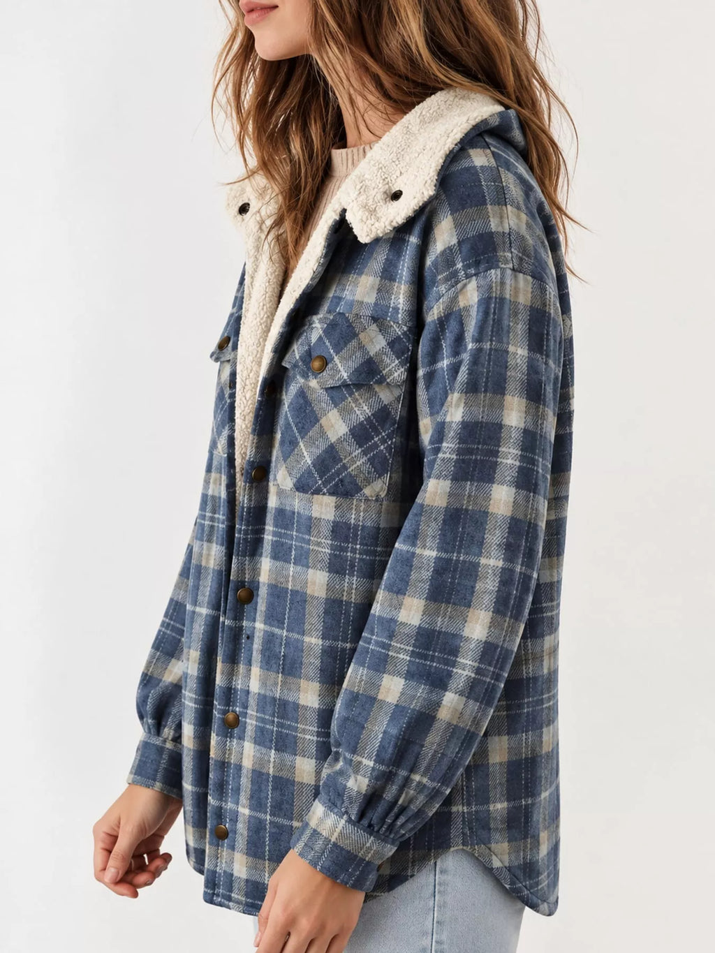 Angled view of the blue plaid jacket and side pocket.
