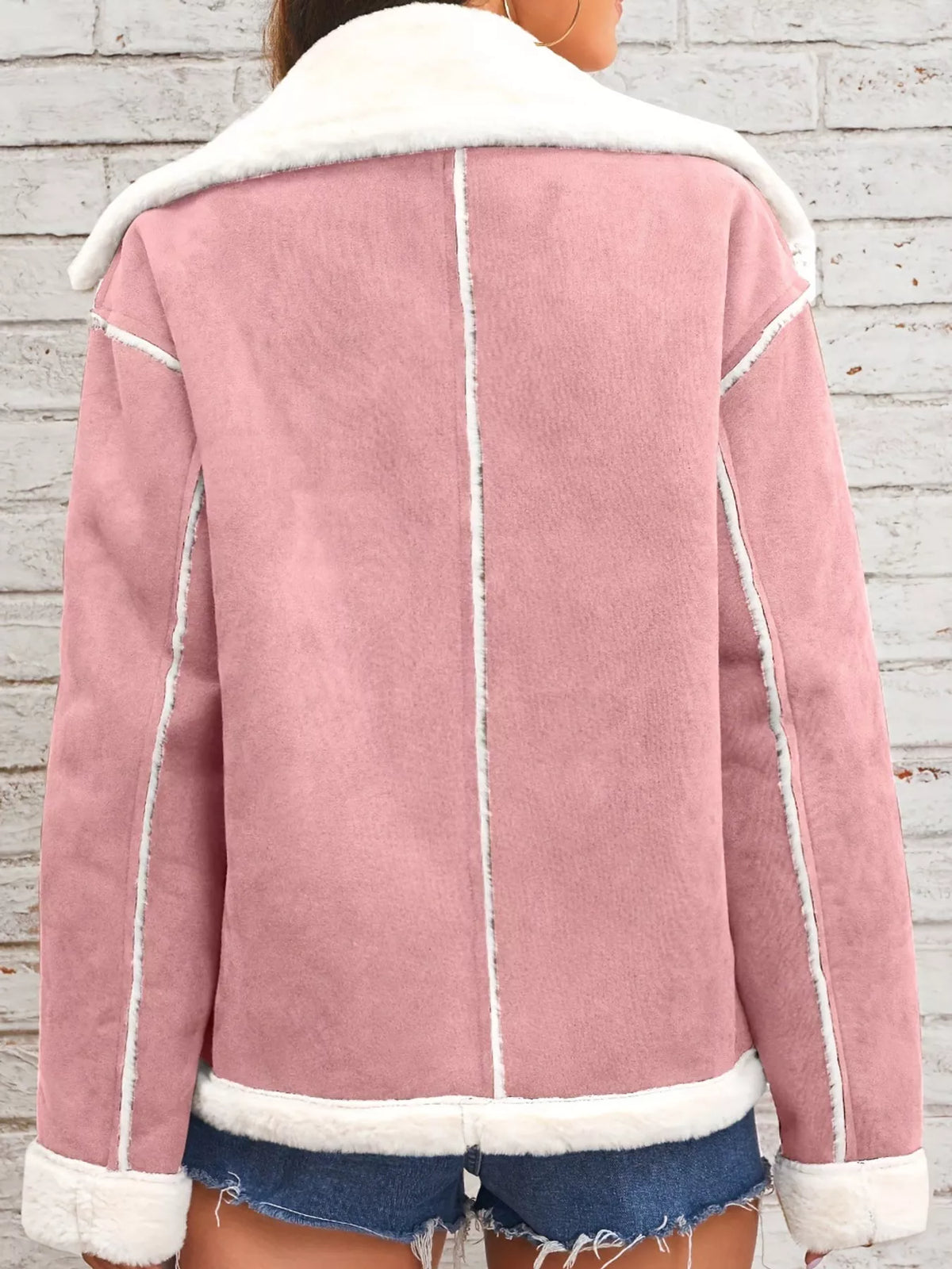Pink jacket with wide white plush lapels, contrast trim and front pockets, back view.