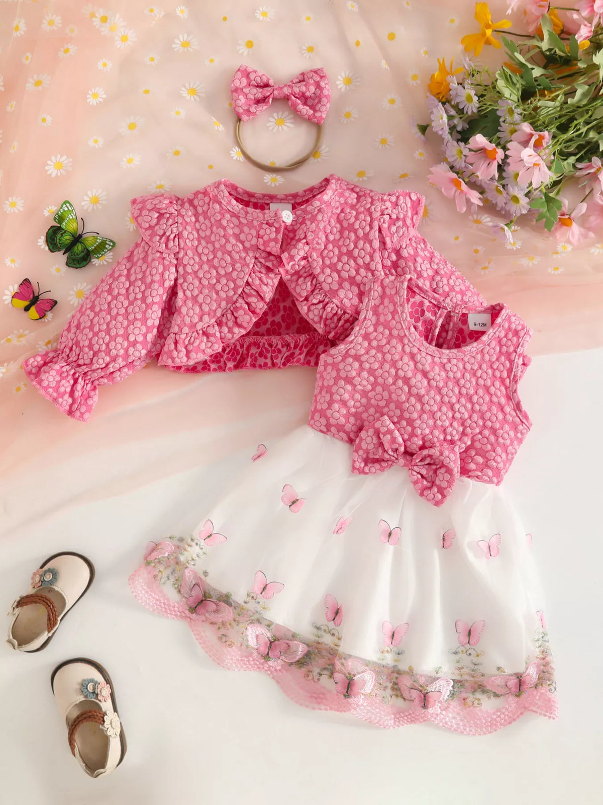 Pink floral baby outfit with cropped jacket, matching vest, white tulle skirt and bow headband.