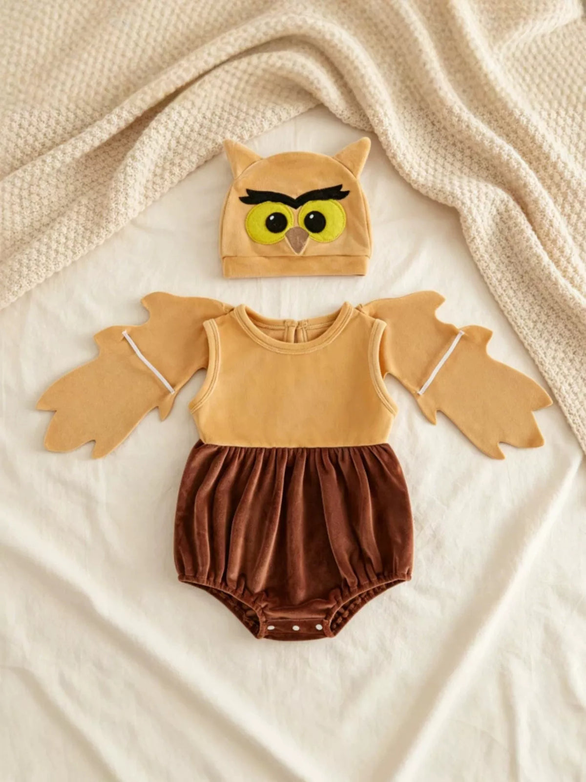 Children’s mustard owl-wing top, brown bottoms and owl hat displayed flat