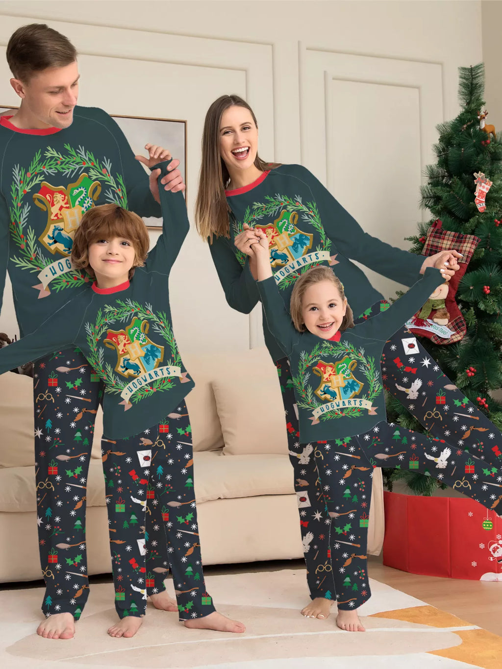 Dark green Hogwarts graphic pajama top with black patterned pants worn by a family
