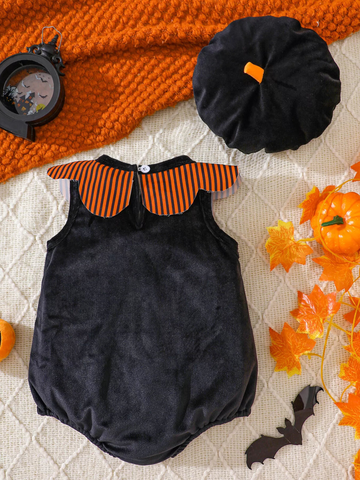 Halloween sleeveless baby bodysuit with striped yoke and matching beret-style hat displayed flat