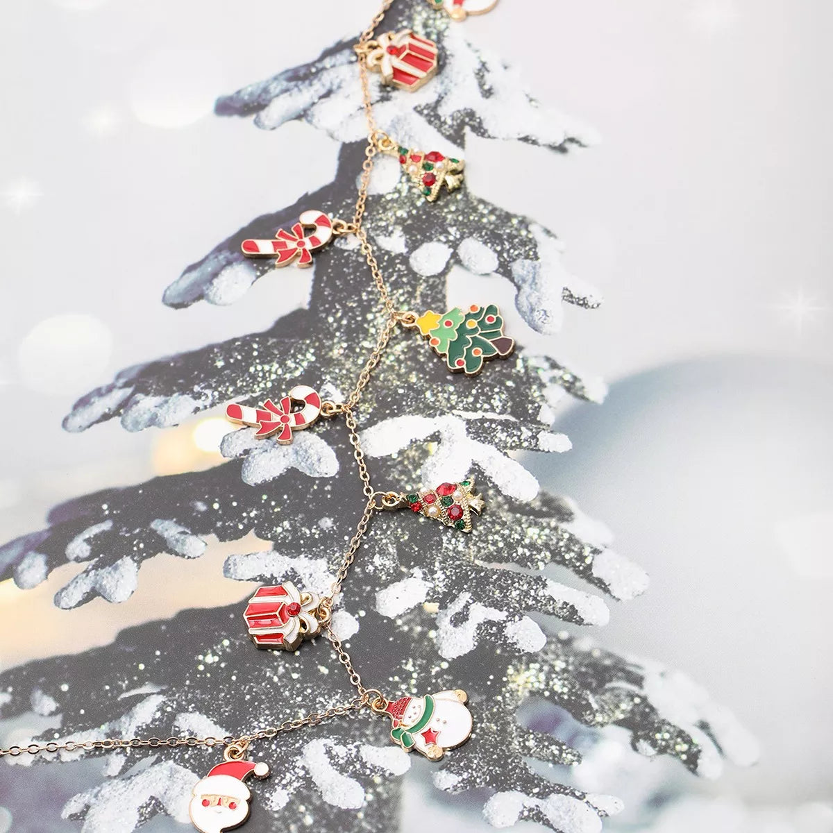 Gold-tone necklace with colorful Christmas charms — detail view