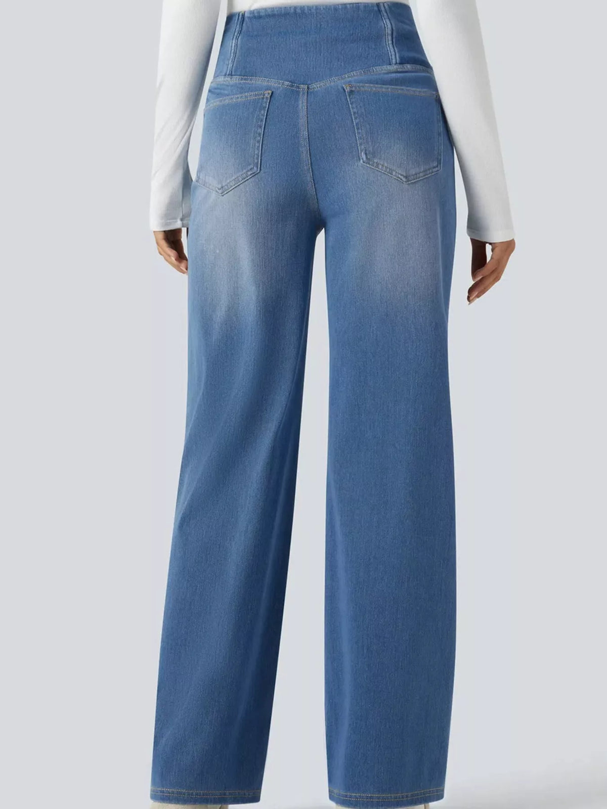Light blue high-waisted crossover waistband straight-leg jeans — back view