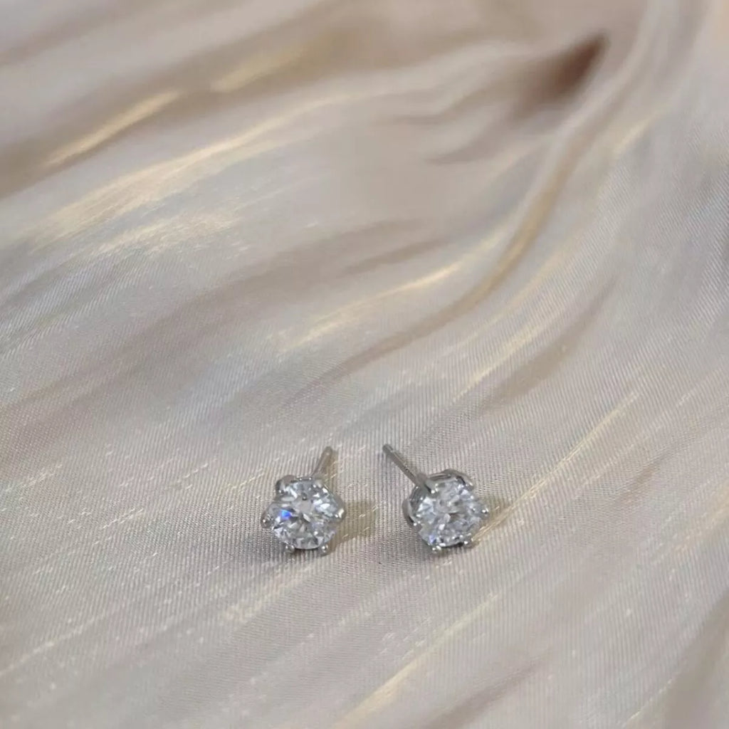 Silver-tone round clear stone stud earrings — detail view