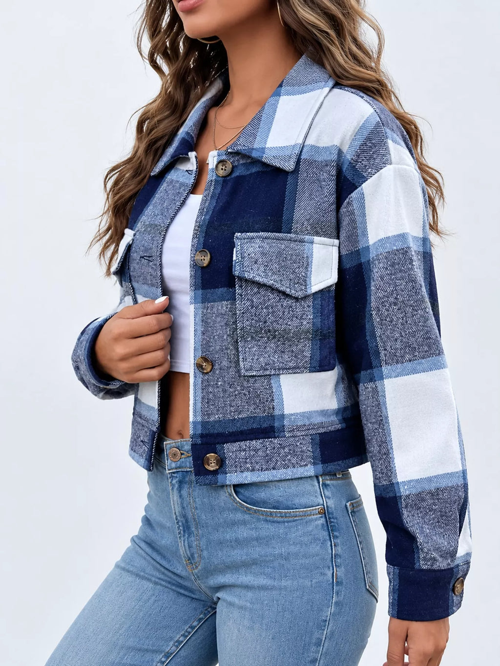 Navy color-block plaid cropped jacket with flap chest pockets, side view.