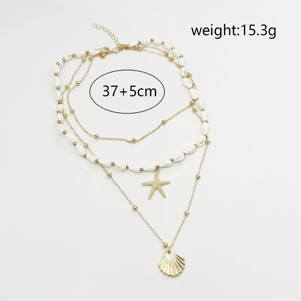 Measurements diagram for layered gold-tone shell and starfish charm necklace