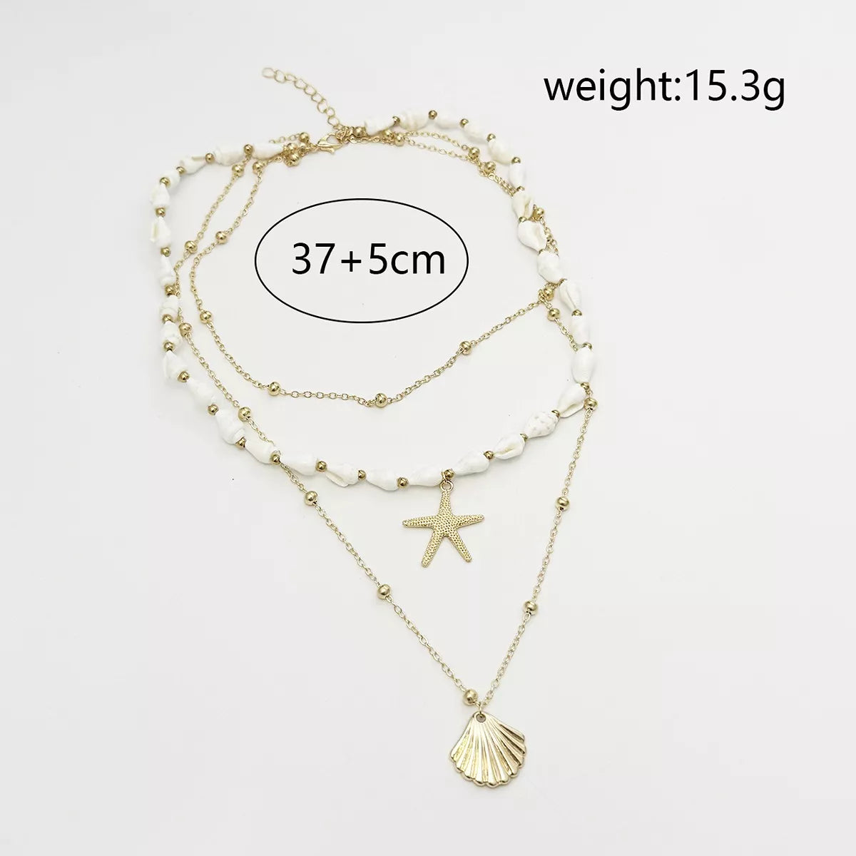 Measurements diagram for layered gold-tone shell and starfish charm necklace