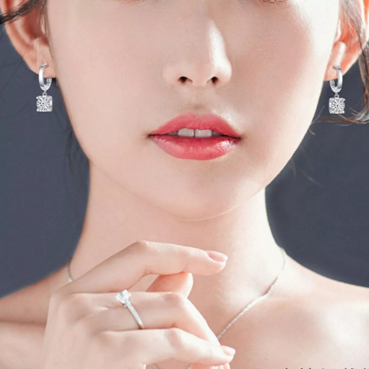 Silver-tone hoop earrings with square clear stone drops