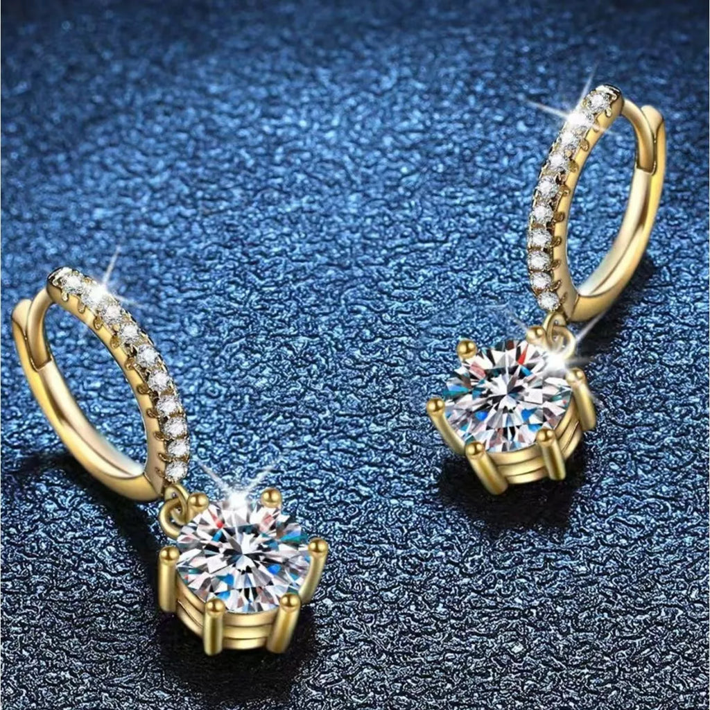 Gold-tone hoop earrings with round clear stone drops — detail view
