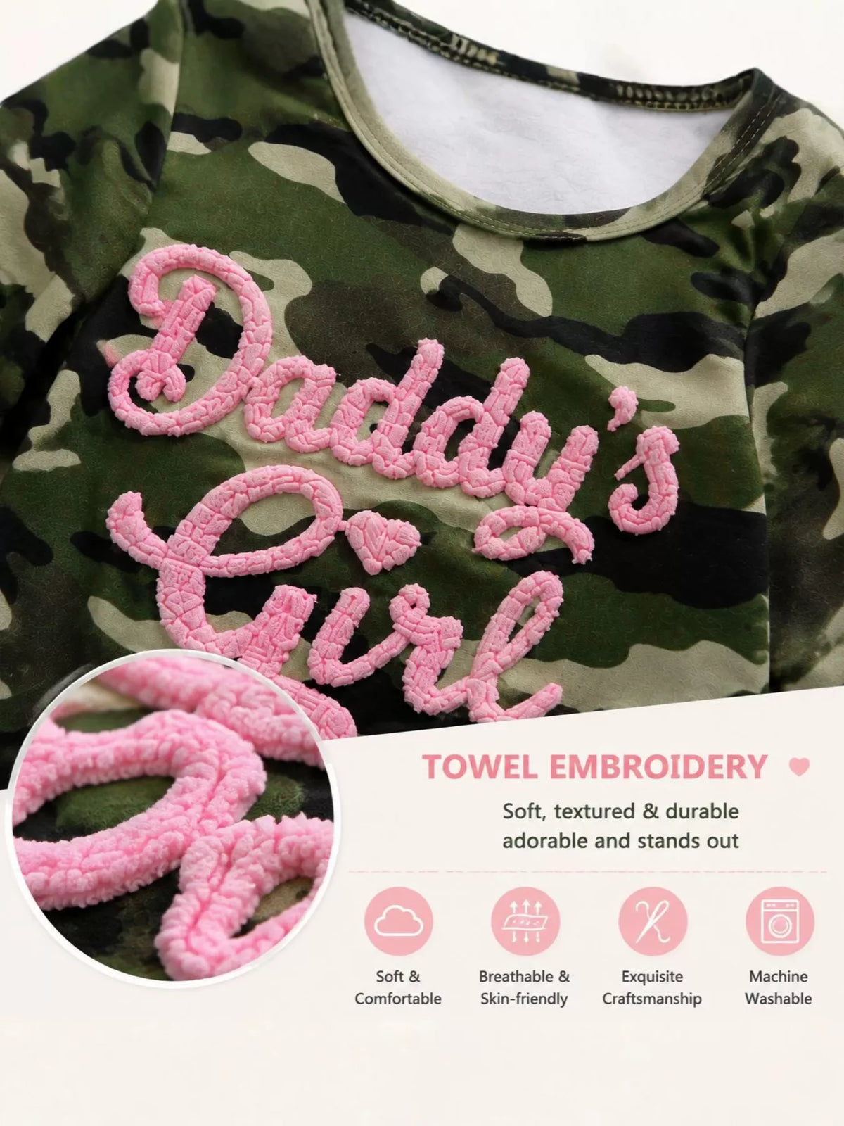 Pink Daddy’s Girl lettering and bow detail on the camouflage jumpsuit