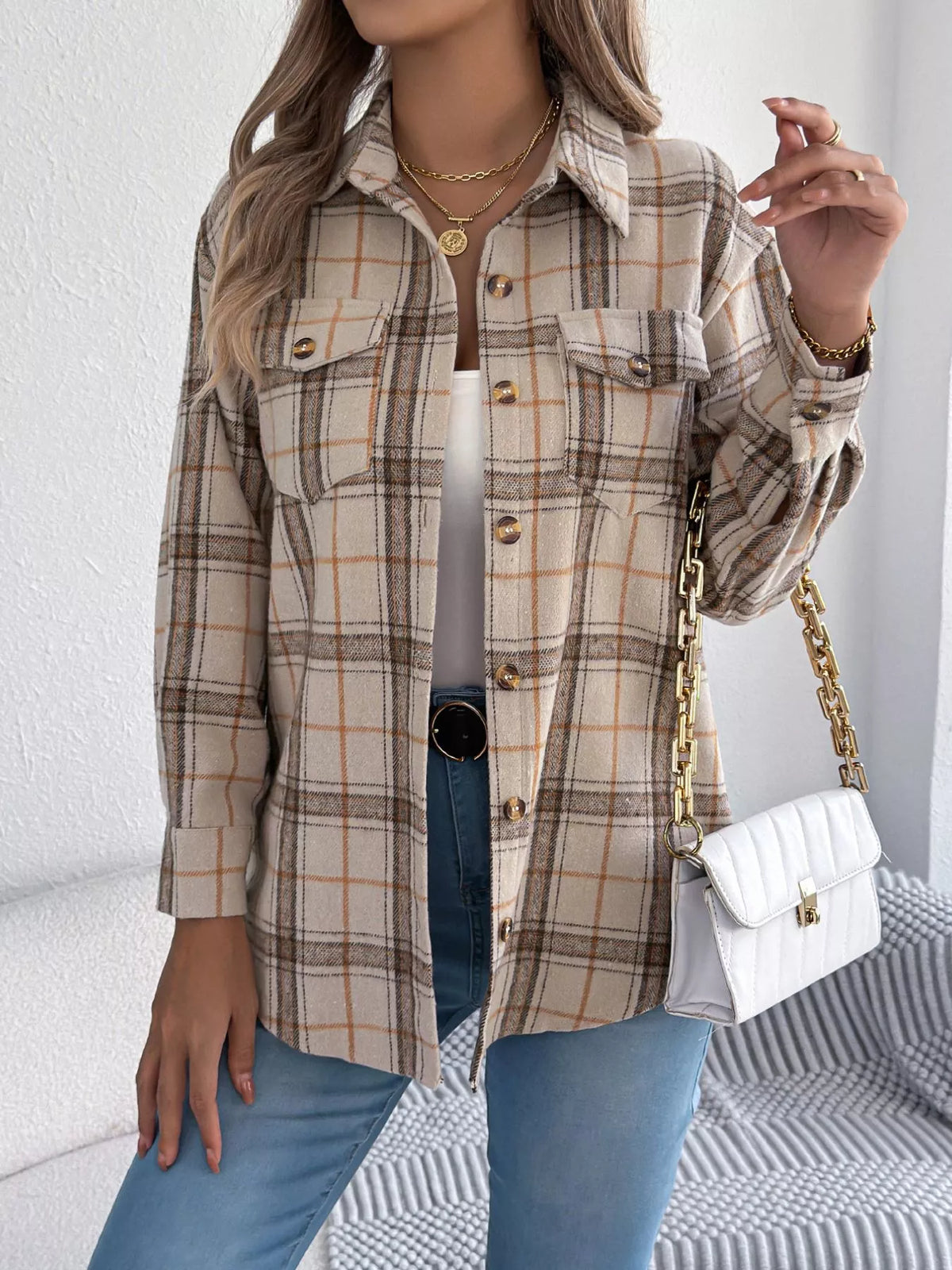 Apricot plaid button-down shacket with chest pockets, front view.