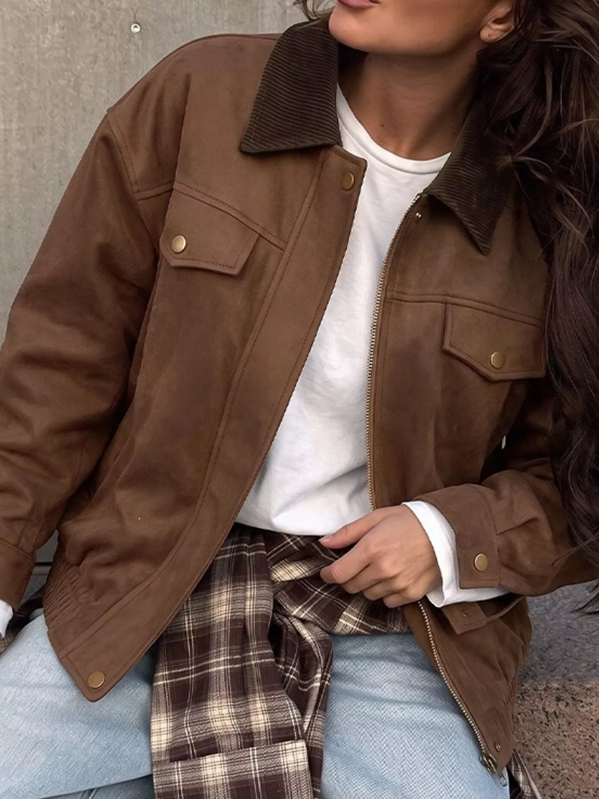Close front view of the brown jacket worn open.