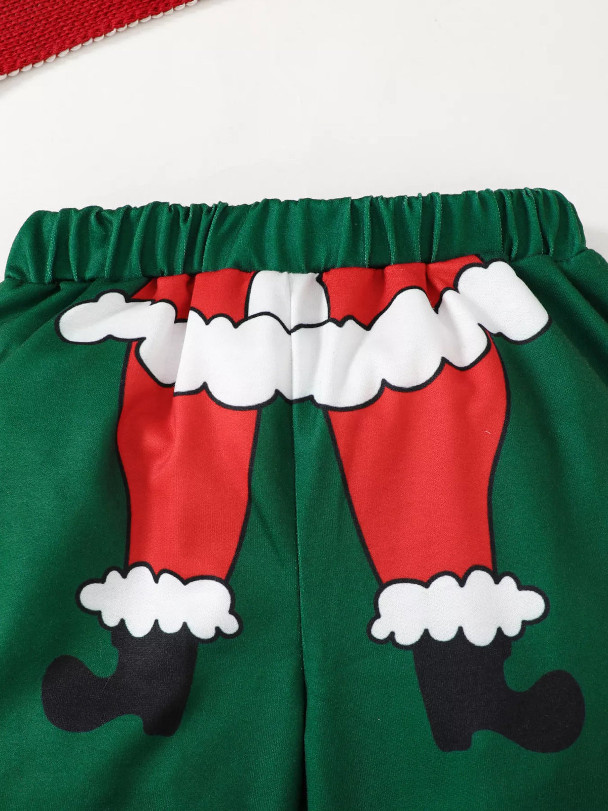 Santa suit graphic and elastic waistband on the green pants
