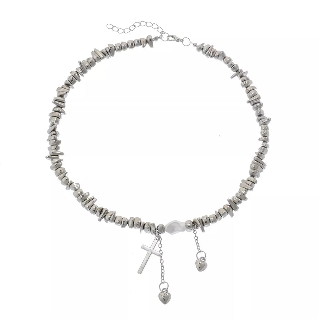 Chunky silver-tone chain necklace with cross and dangling charms — detail view