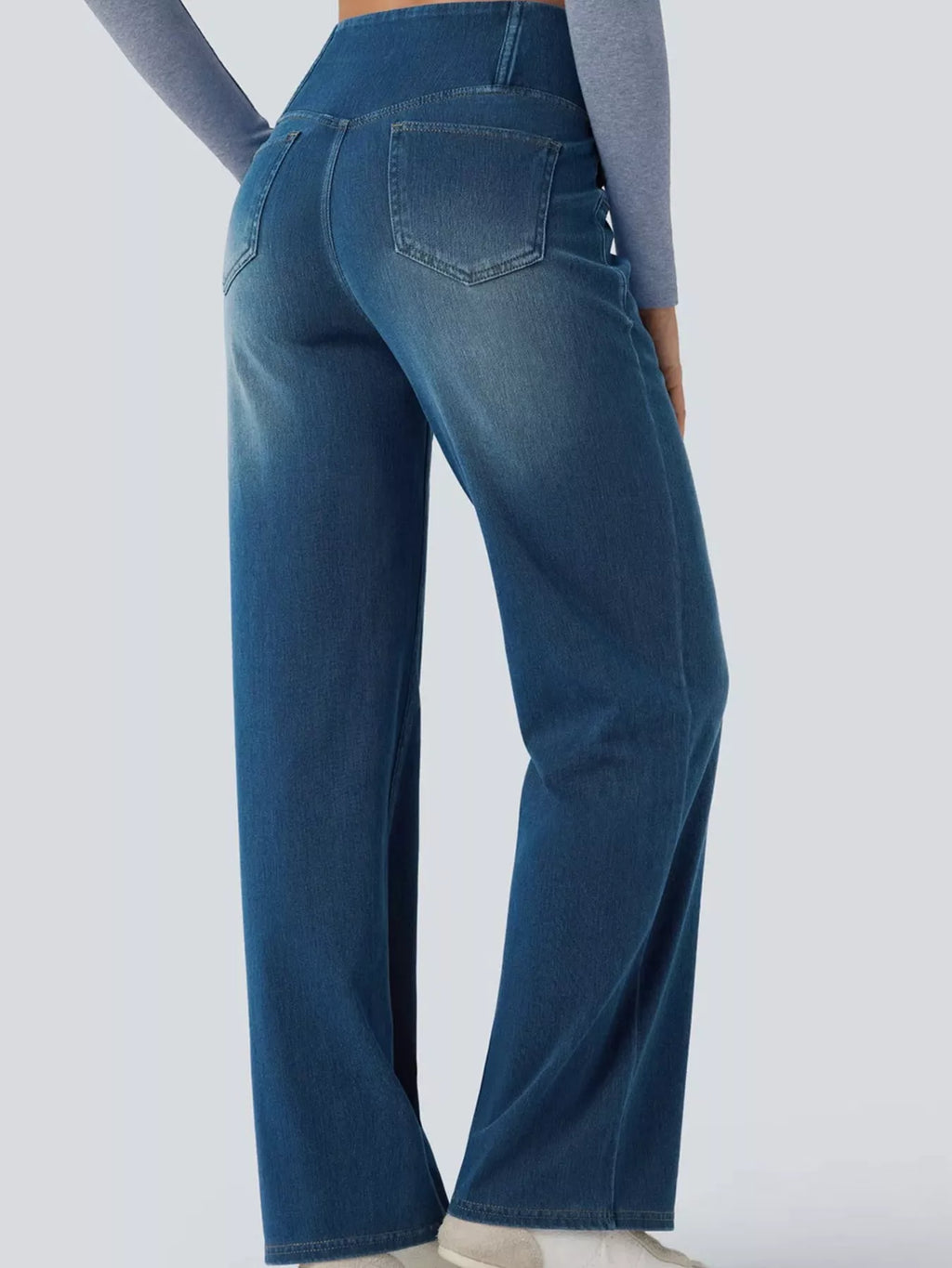 Blue high-waisted crossover waistband straight-leg jeans — back view