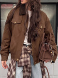 Coffee-brown zip-up jacket with a dark contrast collar and flap chest pockets, modeled from the front.