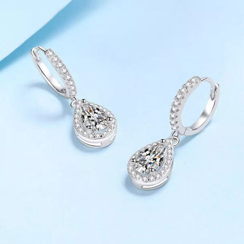 Silver-tone hoop earrings with teardrop halo stone drops