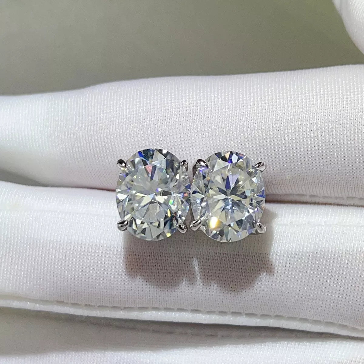 Silver-tone round clear stone stud earrings — detail view