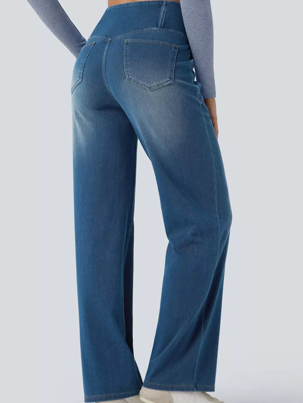 Light blue high-waisted crossover waistband straight-leg jeans — detail view